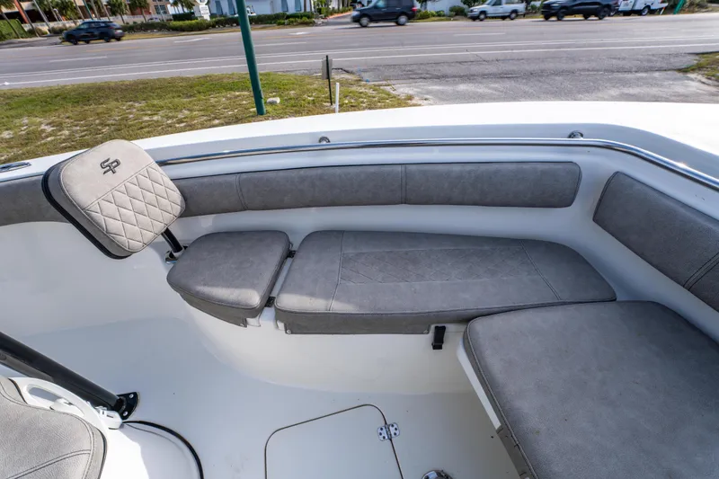 Slide: The Image of 2021 Sea Pro 219 Center Console boat interior with cushioned seating. - 26