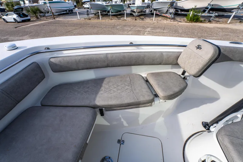 Slide: The Image of 2021 Sea Pro 219 Center Console boat interior with cushioned seating. - 27