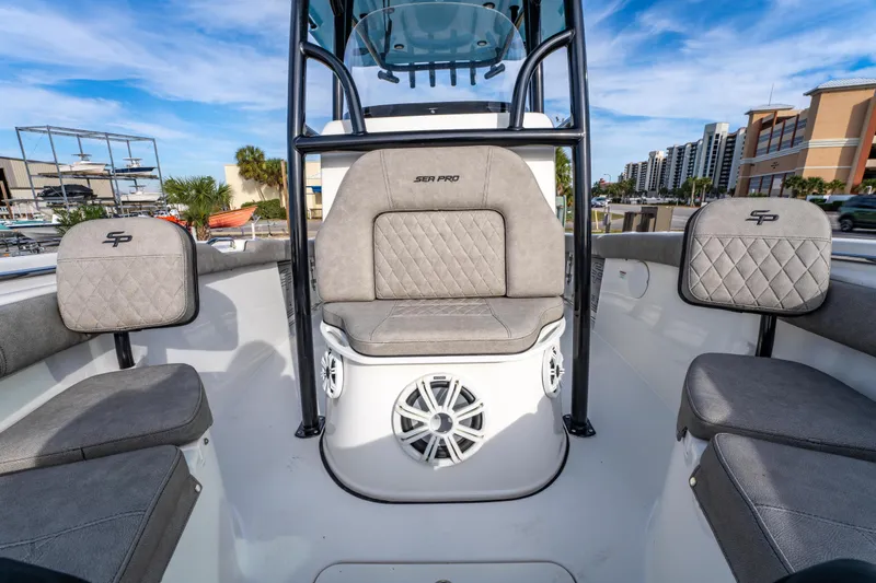 Slide: The Image of 2021 Sea Pro 219 Center Console boat interior with cushioned seating and modern design. - 28