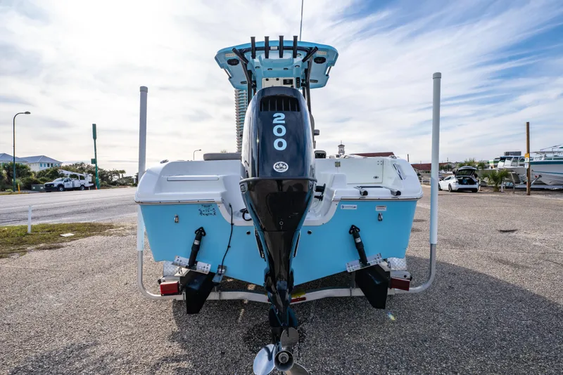 Slide: The Image of 2021 Sea Pro 219 Center Console boat with 200 horsepower engine, parked outdoors. - 4