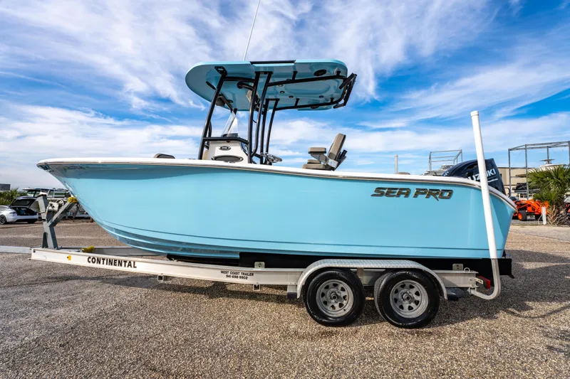 Slide: The Image of 2021 Sea Pro 219 Center Console boat on trailer under blue sky. - 6