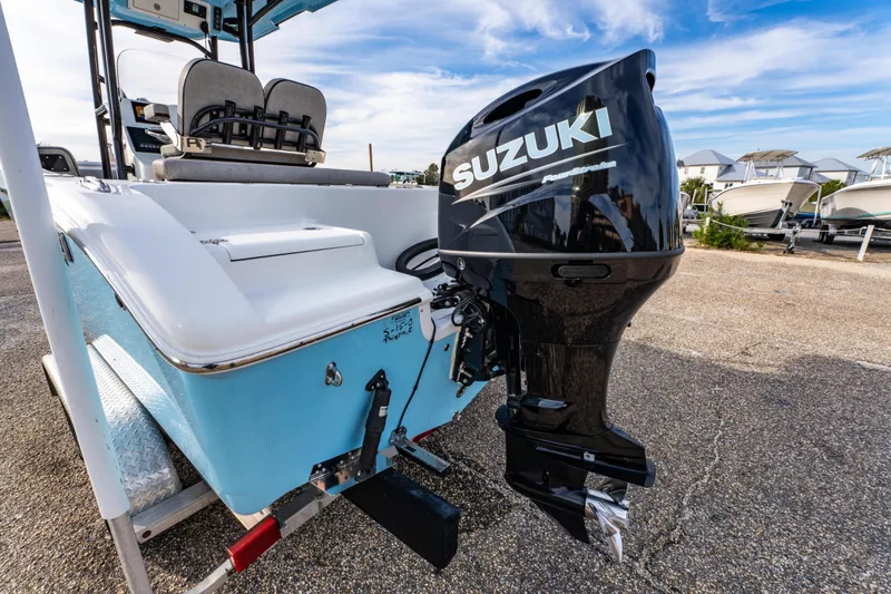 Slide: The Image of 2021 Sea Pro 219 Center Console boat with Suzuki outboard motor, parked on a trailer. - 9
