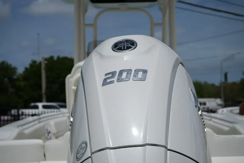 Slide: The Image of Close-up of a 2026 Key West 219 FS boat engine with "200" marking. - 11