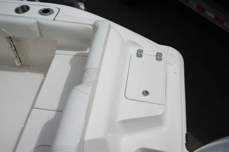 Slide: The Image of 2026 Key West 219 FS boat interior with storage compartment and seating. - 14