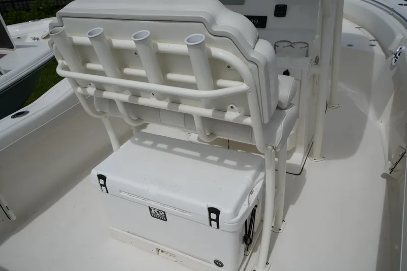 Slide: The Image of 2026 Key West 219 FS boat interior with rod holders and cooler storage. - 15