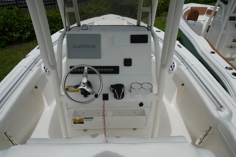 Slide: The Image of 2026 Key West 219 FS boat dashboard with Garmin navigation system and steering wheel. - 17