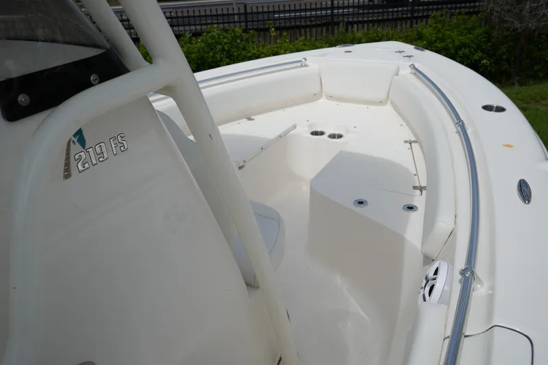 Slide: The Image of 2026 Key West 219 FS boat interior with seating and cup holders. - 21