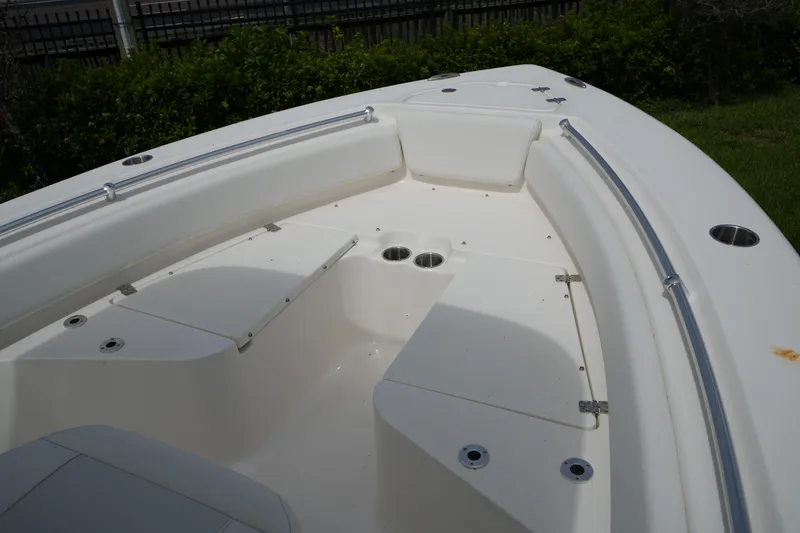 Slide: The Image of 2026 Key West 219 FS boat interior with seating and cup holders. - 22