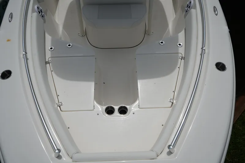 Slide: The Image of Bow seating area of 2026 Key West 219 FS boat with storage compartments. - 23