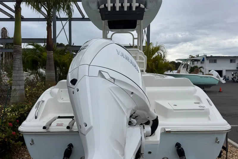 Slide: The Image of 2026 Key West 219 FS boat with Yamaha outboard motor, parked outdoors. - 3