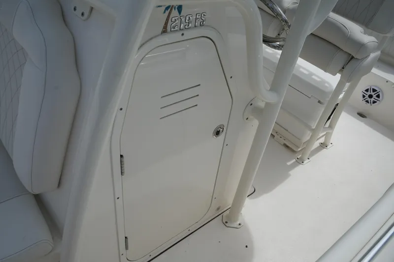 Slide: The Image of 2026 Key West 219 FS boat interior with white seating and storage compartment. - 31