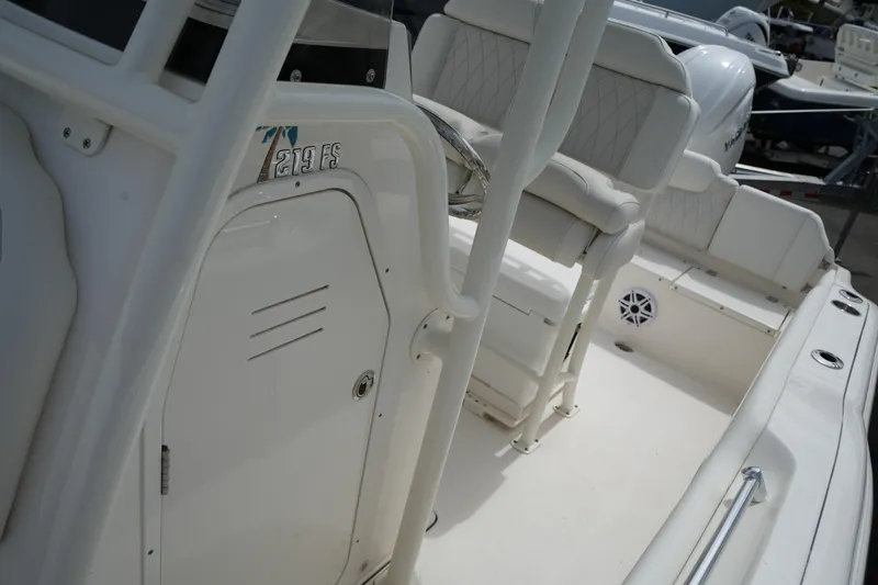 Slide: The Image of 2026 Key West 219 FS boat interior with seating and steering console. - 32
