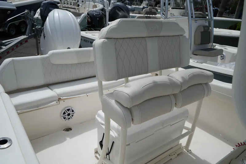 Slide: The Image of 2026 Key West 219 FS boat interior with white cushioned seating and modern design. - 41