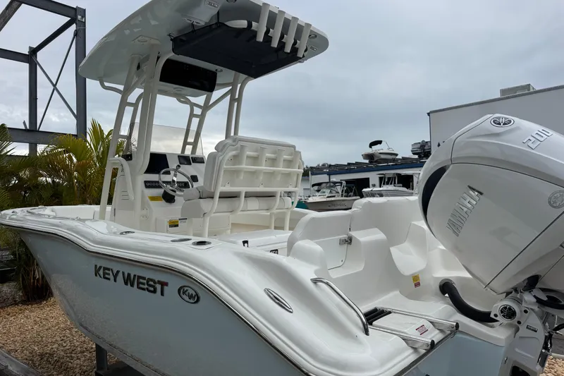 Slide: The Image of 2026 Key West 219 FS boat with Yamaha engine, docked outdoors. - 5