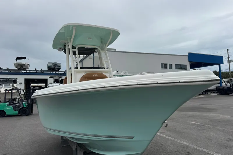 Slide: The Image of 2026 Key West 219 FS boat in a marina, showcasing sleek design and modern features. - 10