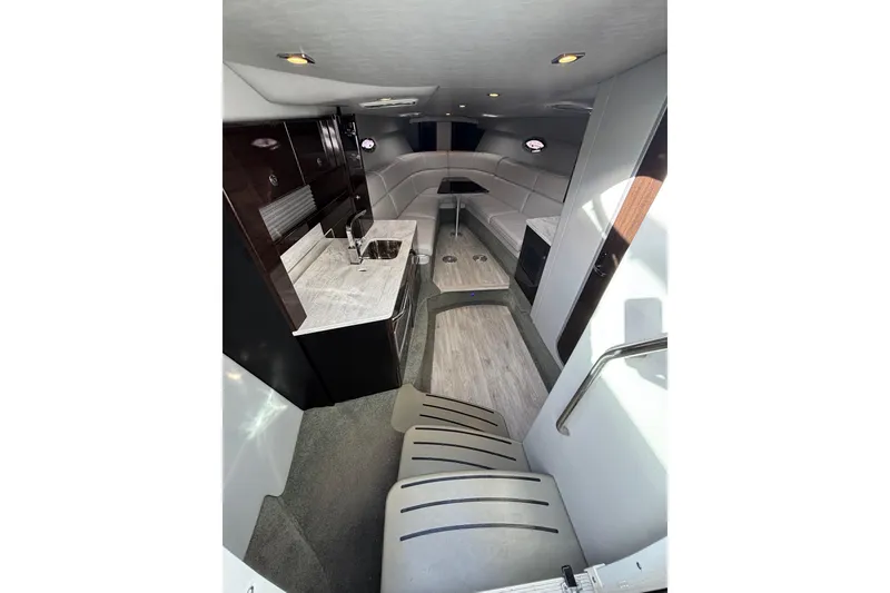 Slide: The Image of Interior of 2017 Formula 370 Super Sport boat with modern kitchen and seating area. - 19