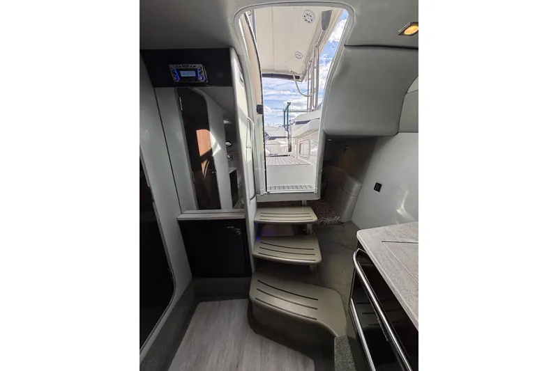 Slide: The Image of Interior view of 2017 Formula 370 Super Sport yacht with modern staircase and sleek design. - 20