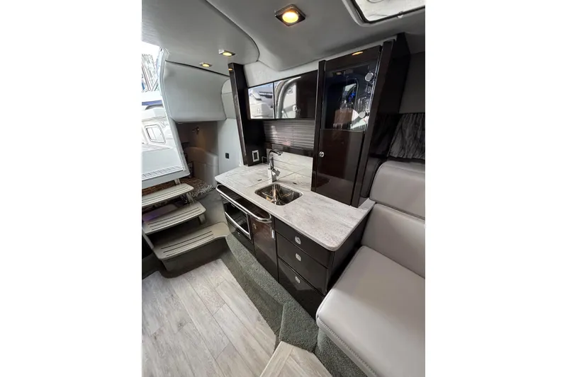 Slide: The Image of Luxurious interior of 2017 Formula 370 Super Sport yacht with modern kitchenette and seating. - 24