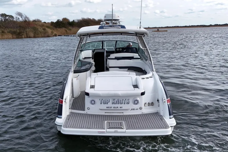 Slide: The Image of 2017 Formula 370 Super Sport boat on water, rear view, "Top Knots" name visible. - 5