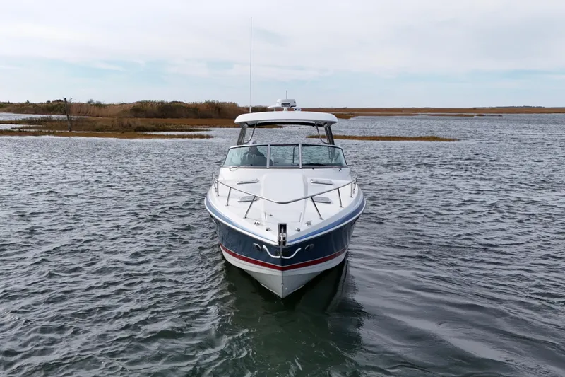 Slide: The Image of 2017 Formula 370 Super Sport boat on calm water, front view. - 6