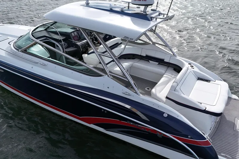 Slide: The Image of 2017 Formula 370 Super Sport boat on water, featuring sleek design and spacious seating. - 7