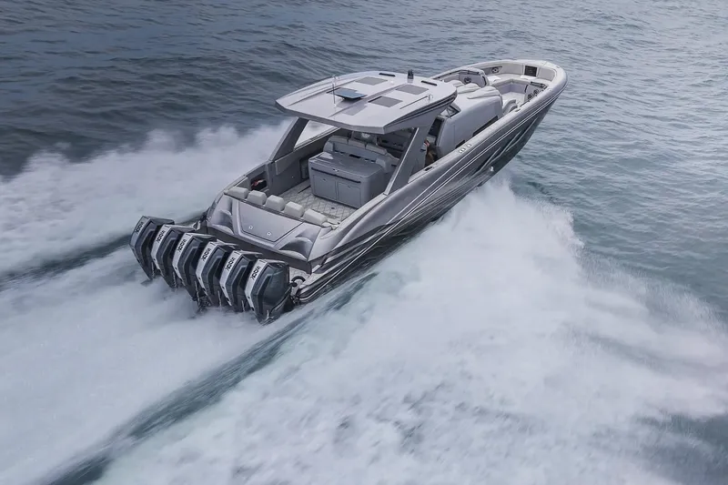 Slide: The Image of 2026 Deep Impact 499 Sport boat speeding on open water with powerful engines. - 21