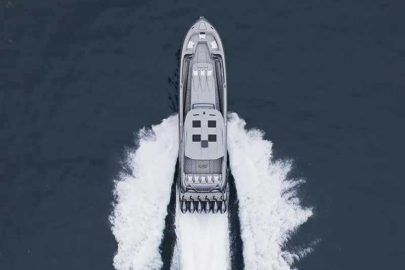 Slide: The Image of Aerial view of 2026 Deep Impact 499 Sport boat cruising on water. - 22