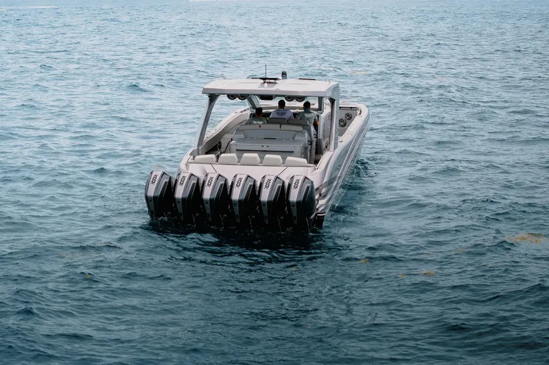 Slide: The Image of 2026 Deep Impact 499 Sport boat with multiple engines on open water. - 26