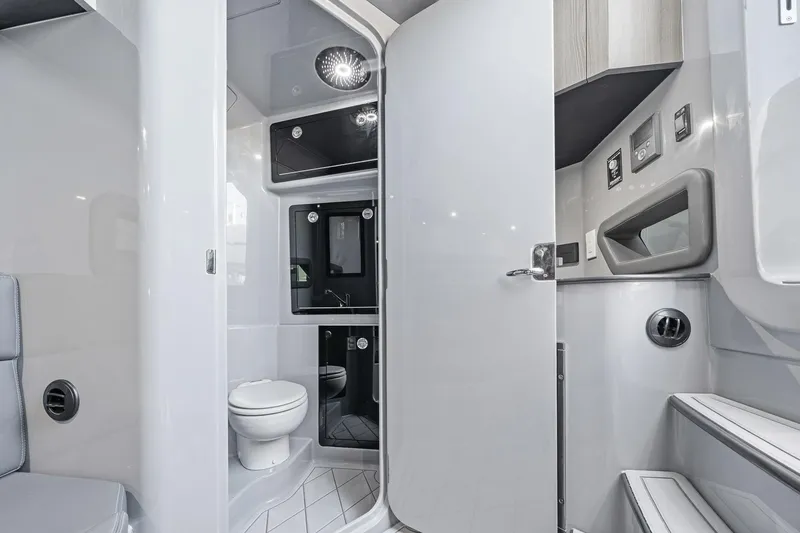 Slide: The Image of Modern bathroom interior in 2026 Deep Impact 499 Sport boat, featuring sleek design and amenities. - 28