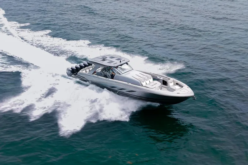 Slide: The Image of 2026 Deep Impact 499 Sport boat cruising swiftly on open water. - 3