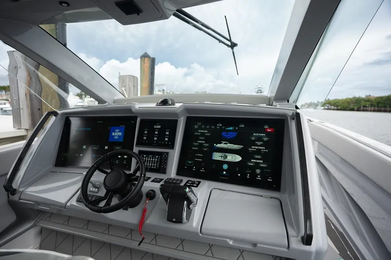 Slide: The Image of Cockpit of 2026 Deep Impact 499 Sport boat with advanced navigation displays. - 34