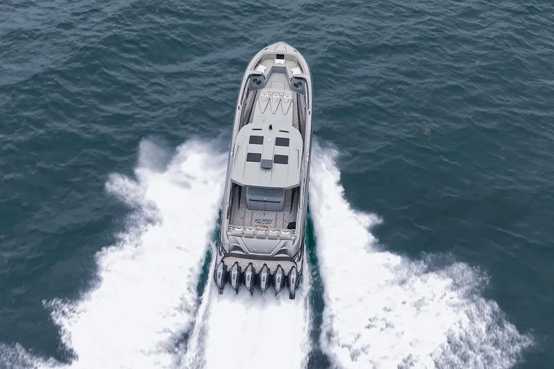 Slide: The Image of Aerial view of 2026 Deep Impact 499 Sport boat speeding on water. - 4