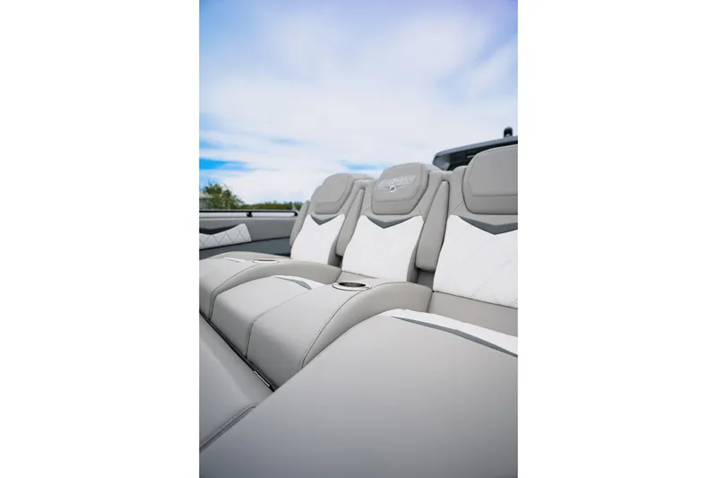 Slide: The Image of Luxurious seating in 2026 Deep Impact 499 Sport boat, featuring elegant gray and white upholstery. - 41