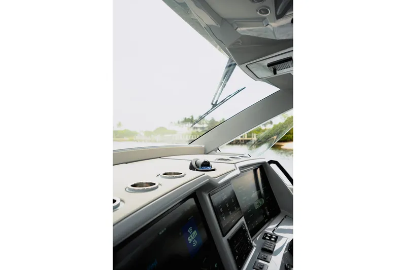Slide: The Image of Interior view of 2026 Deep Impact 499 Sport boat cockpit with advanced navigation displays. - 45