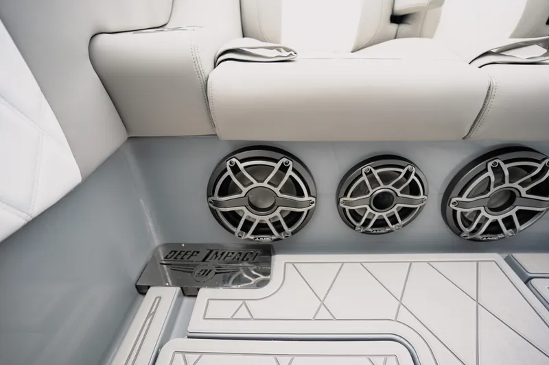 Slide: The Image of 2026 Deep Impact 499 Sport boat interior with premium speakers and sleek seating design. - 50
