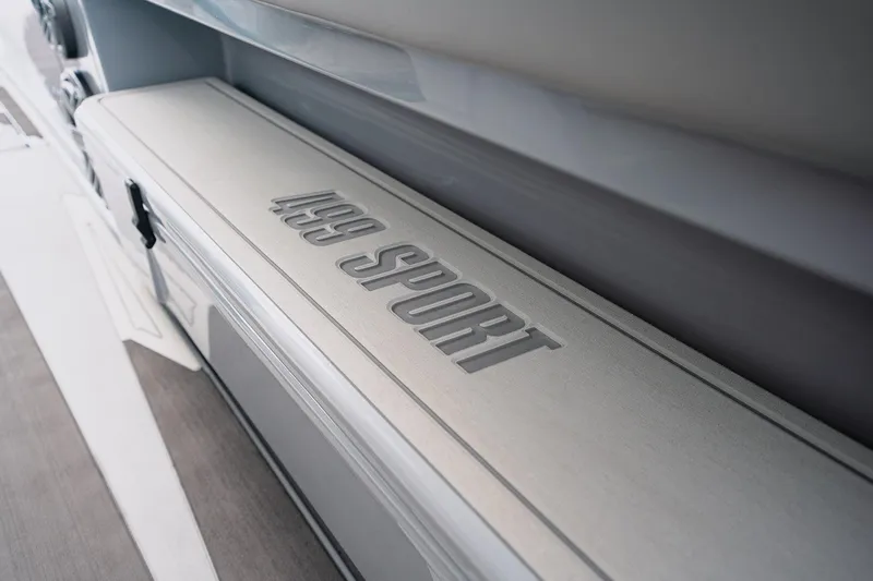 Slide: The Image of 2026 Deep Impact 499 Sport boat interior detail with embossed branding. - 51