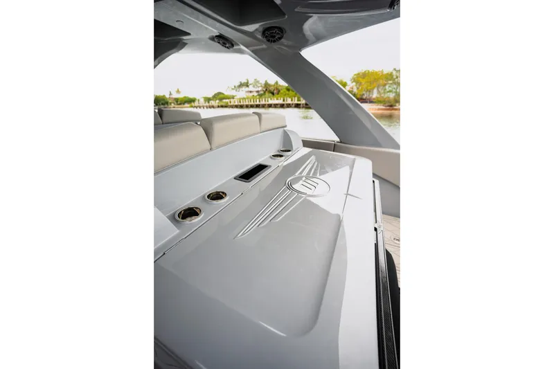 Slide: The Image of 2026 Deep Impact 499 Sport boat interior with sleek design and cup holders. - 55