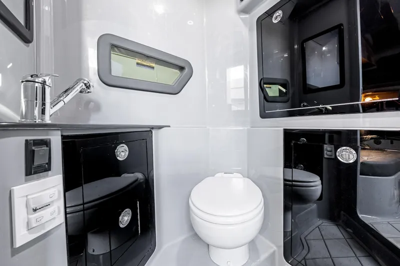 Slide: The Image of Modern bathroom interior in 2026 Deep Impact 499 Sport boat, featuring sleek fixtures and compact design. - 57