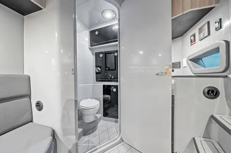 Slide: The Image of Modern bathroom interior in 2026 Deep Impact 499 Sport boat, featuring sleek design and amenities. - 58