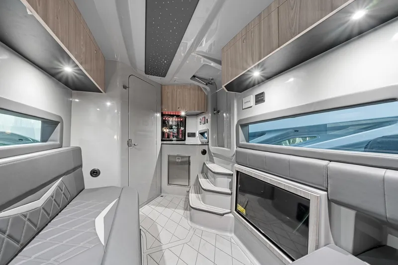 Slide: The Image of Luxurious interior of 2026 Deep Impact 499 Sport boat with modern seating and ambient lighting. - 59