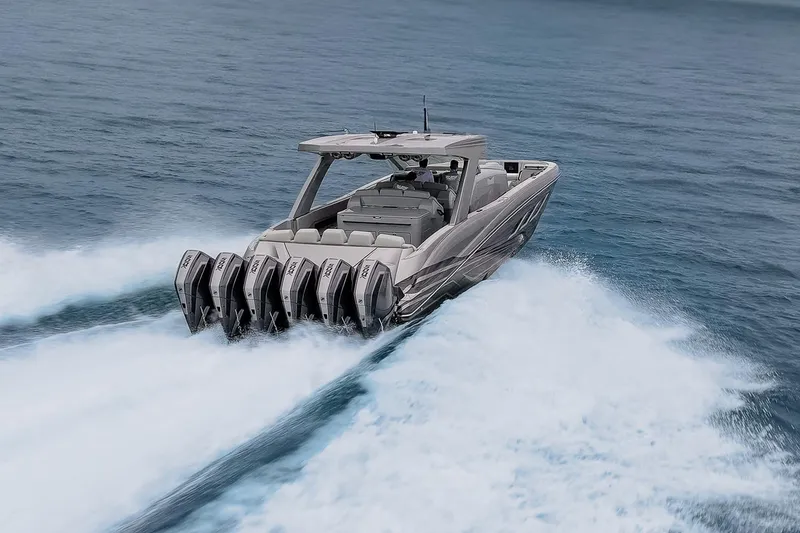 Slide: The Image of 2026 Deep Impact 499 Sport boat speeding on open water with powerful engines. - 65