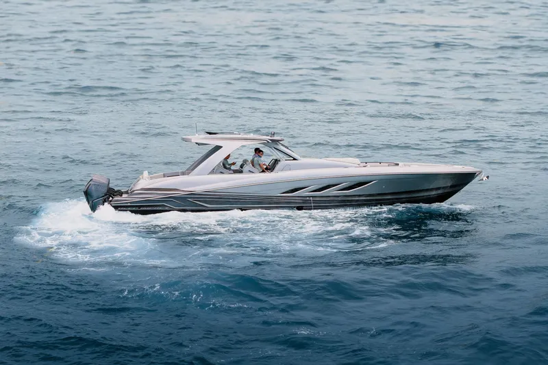 Slide: The Image of 2026 Deep Impact 499 Sport boat cruising on open water. - 68