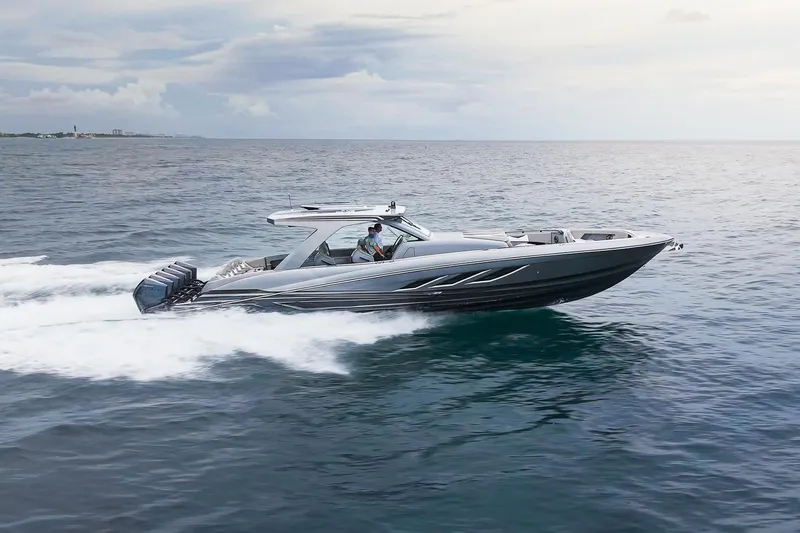 Slide: The Image of 2026 Deep Impact 499 Sport boat cruising on open water, showcasing sleek design and speed. - 8