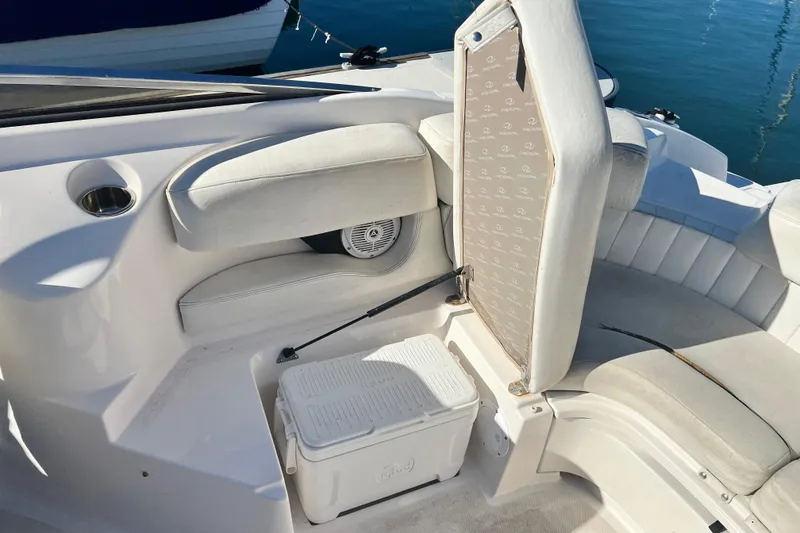 Slide: The Image of 2006 Regal Marine 2650 Cuddy boat interior with seating and storage. - 18