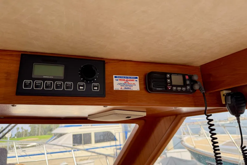 Slide: The Image of Control panel and radio equipment inside a 1988 Offshore Yachts 48 Sedan. - 50