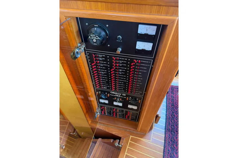 Slide: The Image of Electrical panel of 1988 Offshore Yachts 48 Sedan with switches and gauges. - 53