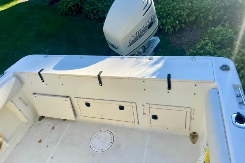 Slide: The Image of 2001 Hydra-Sports 230 Seahorse CC boat deck with Johnson outboard motor. - 6