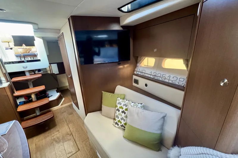 Slide: The Image of Interior of 2021 Sea Ray Sundancer 350 yacht with cozy seating and modern decor. - 13