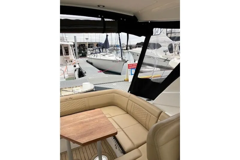 Slide: The Image of Interior view of 2021 Sea Ray Sundancer 350 yacht at marina dock. - 16