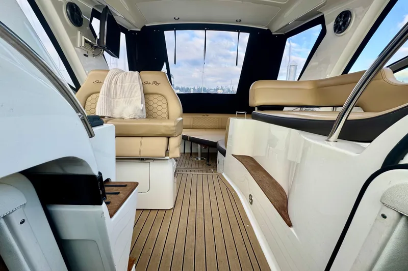 Slide: The Image of Luxurious interior of 2021 Sea Ray Sundancer 350 yacht with beige seating and wood flooring. - 2